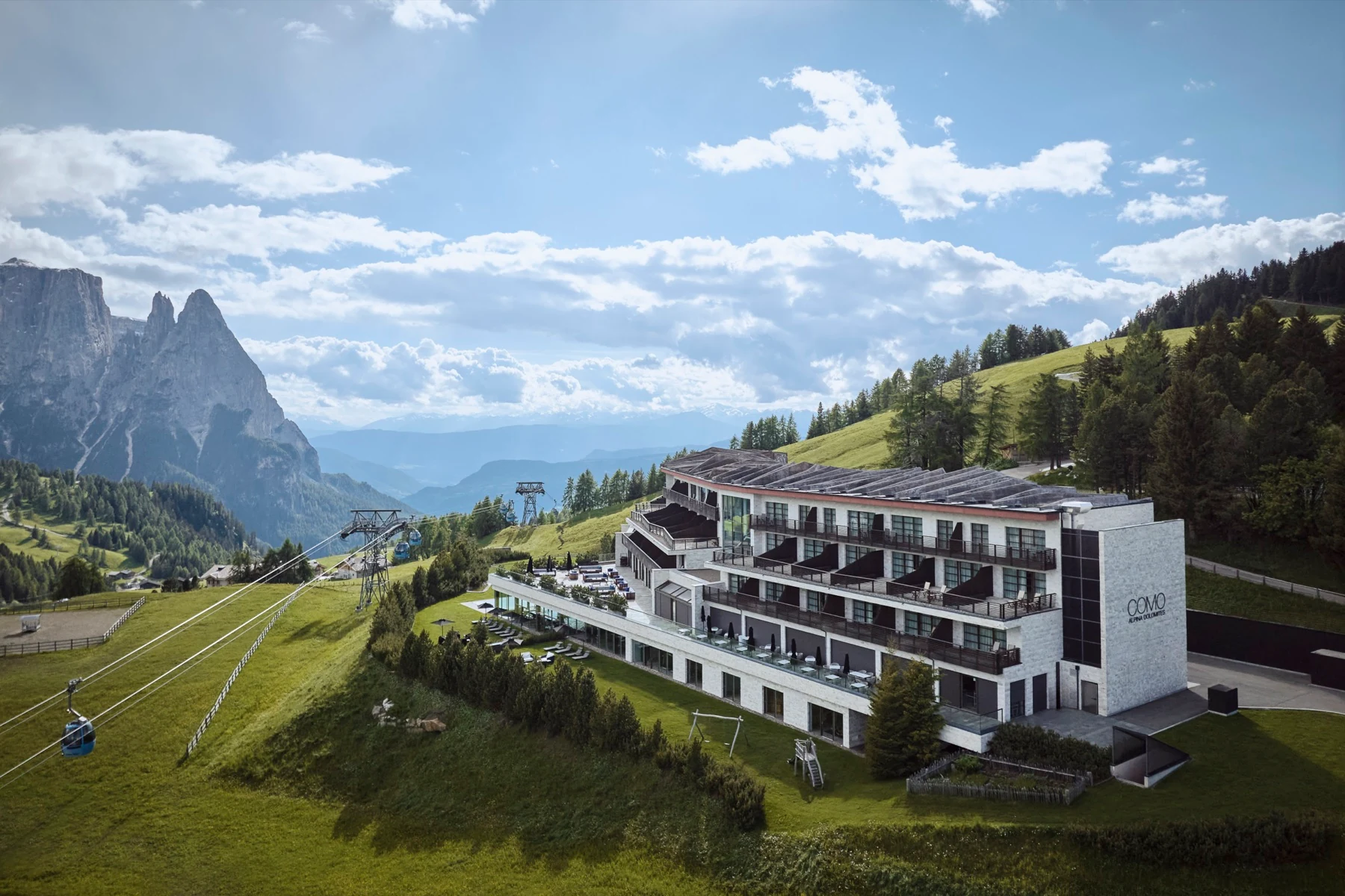 COMO Alpina Dolomites with the Sciliar peaks behind