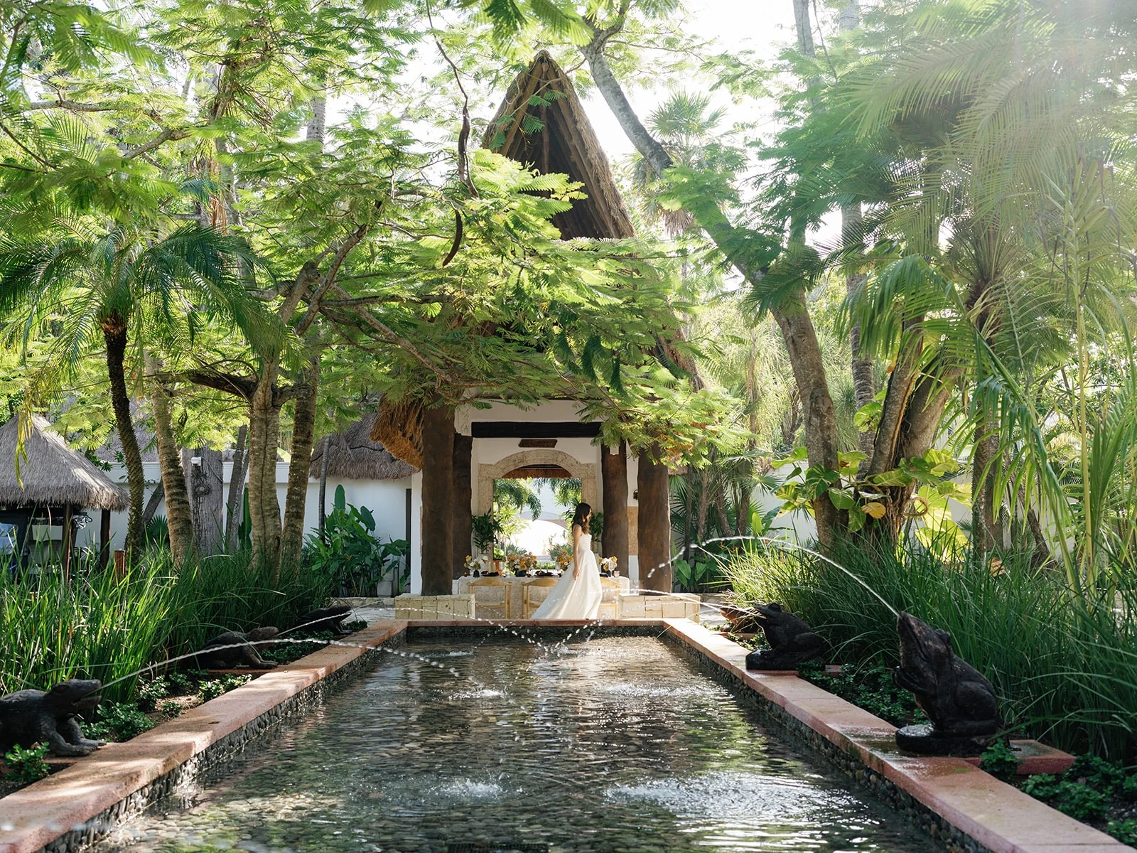 A Wedaways bride at the palapa and reflecting pool, Maroma, A Belmond Hotel